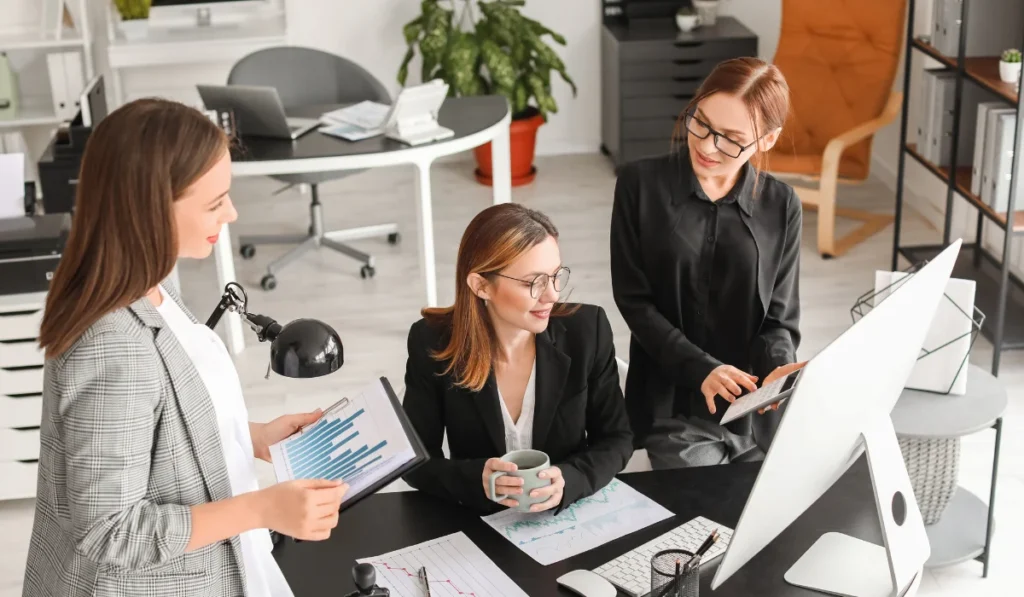 Female Accountants Working in Office